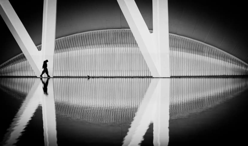 the line - figure walking a thin path of light between shadow in palma