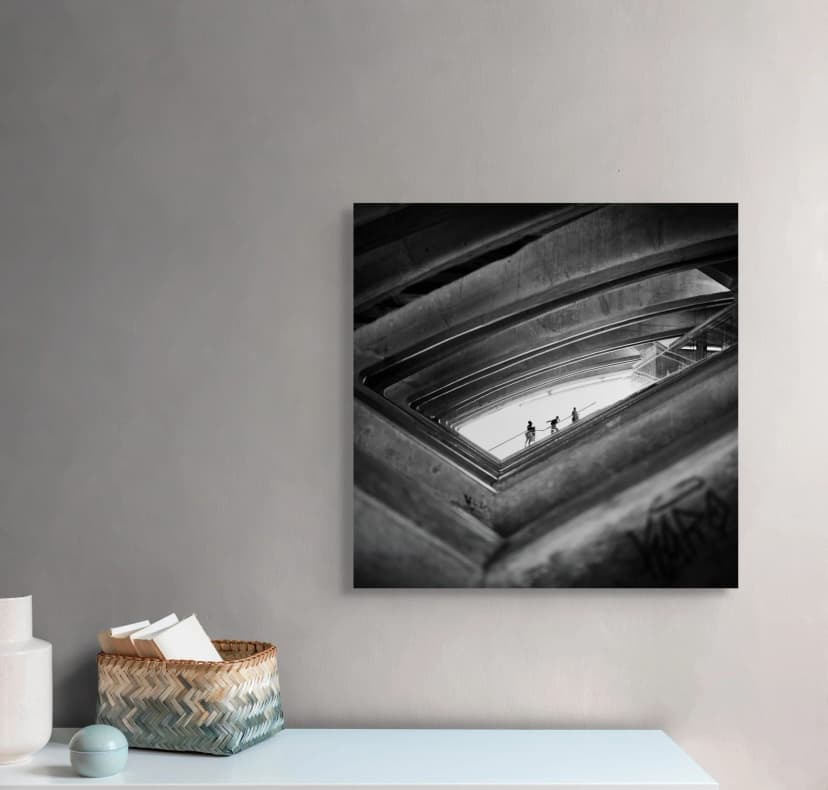 concrete rhythm - woman ascending through brutalist parking structure in palma