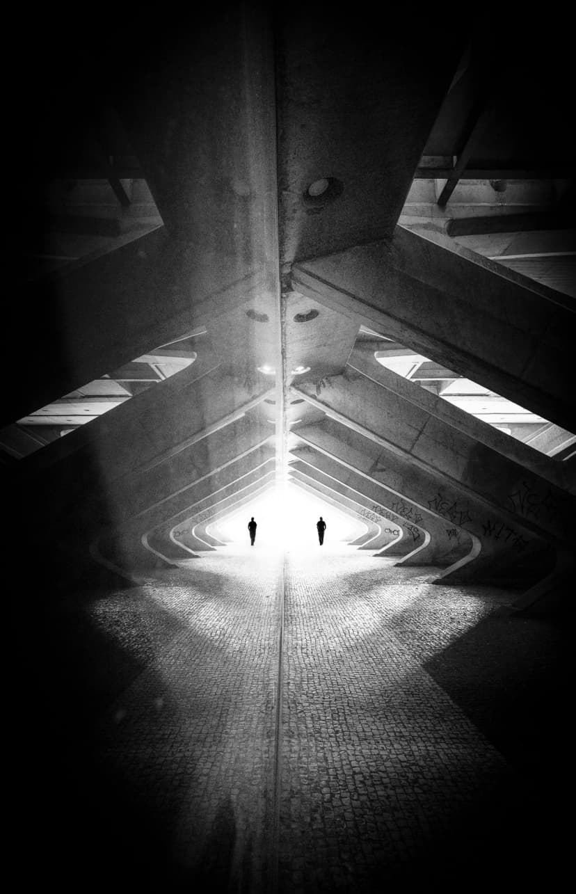 ghosts in geometry - two figures in architectural framework in lisbon