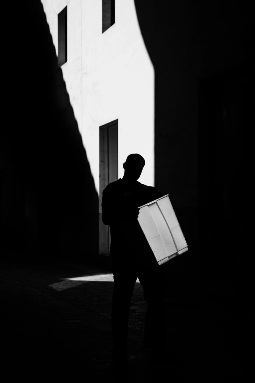 the carrier - man descending stairs in palma de mallorca